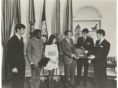 Logo for President Nixon with JA Students