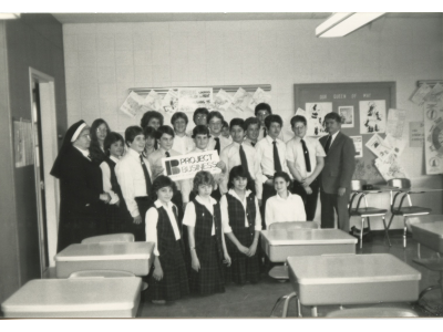 Logo for Students Gather After Participating in Project Business