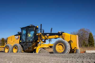 A Caterpillar tractor moving dirt.