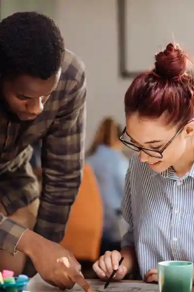 Two young people working together on a project.