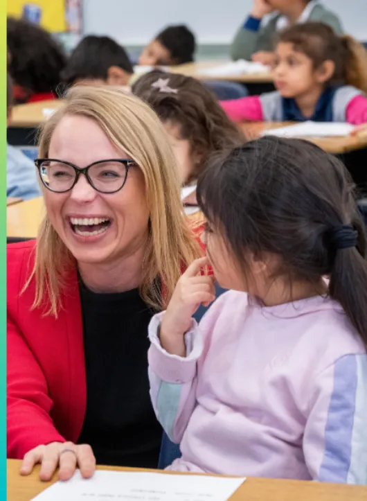 Volunteer working with a student